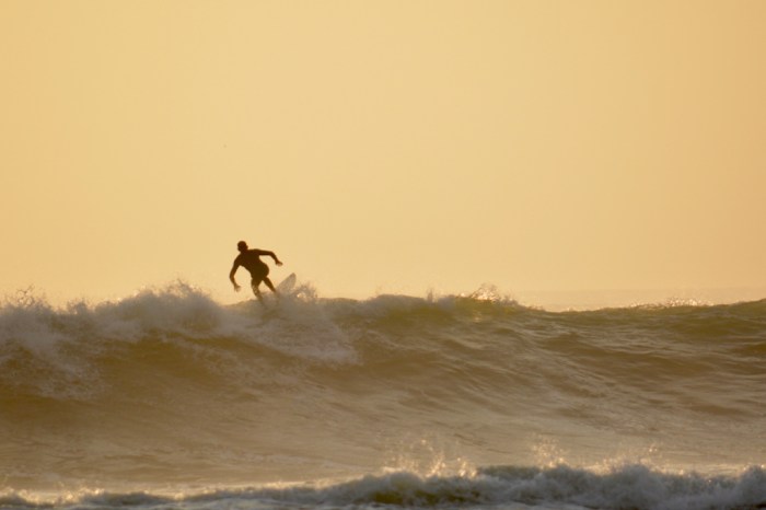 Surfing at sunset in Huanchaco