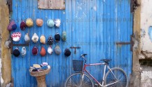 Blue door, bike and hats, Essaouira, Morocco