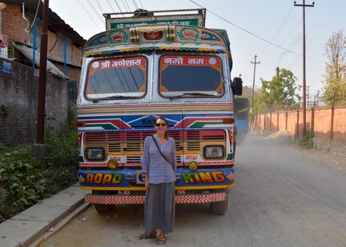 Woman and Road King Tata truck